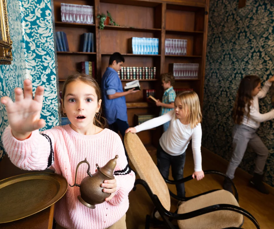 Young children playing in a kids escape room