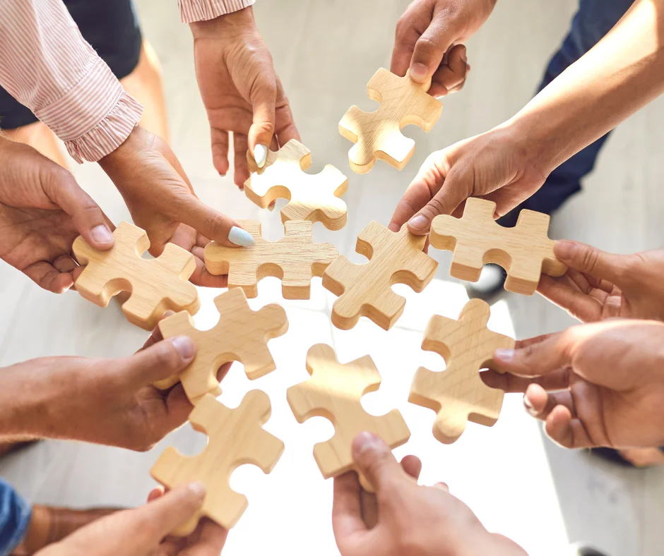 People solving a jigsaw puzzle