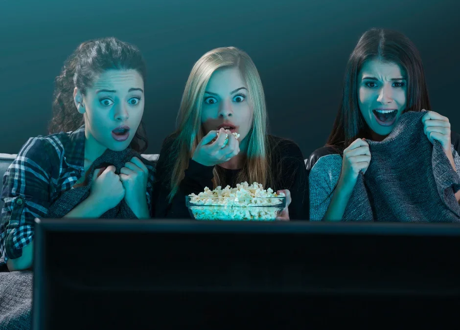 Teenagers watching scary escape room shows